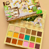 Makeup palette with colorful shades and a character design on a beige background