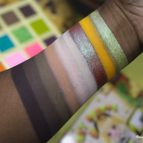 Color swatches on a hand with a blurred background